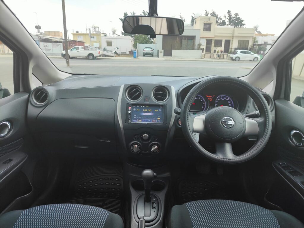Nissan Note interior showing right-hand drive dashboard, touchscreen and automatic gear selector