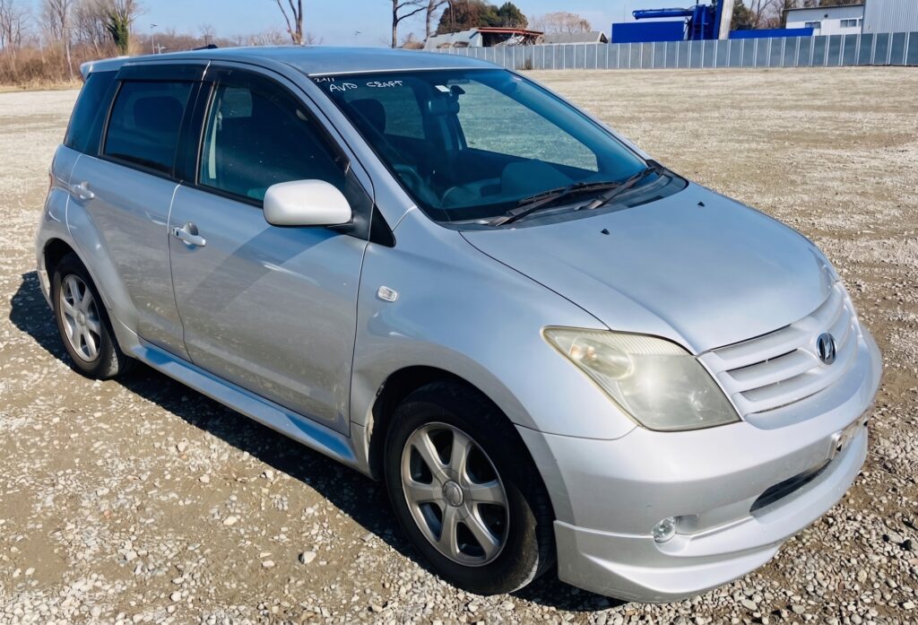 Silver Toyota ist compact hatchback hire car, front three-quarter view